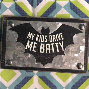 Batty wood and metal sign.